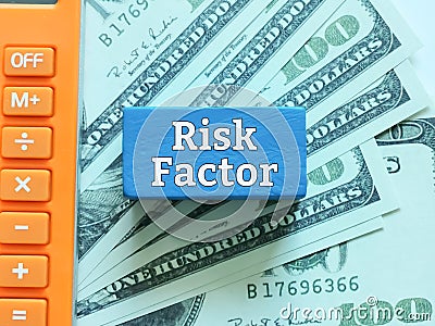 Phrase risk factor on blue cube Stock Photo