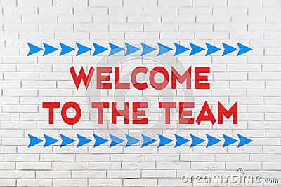 Phrase Welcome to the team on brick wall Stock Photo