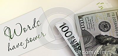 The phrase Words Have Power written on card, 100 Euro bill and 100 dollar banknote. Storytelling concept Stock Photo