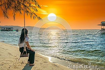 Silhouette of traveler Asian woman watching the sunset Editorial Stock Photo