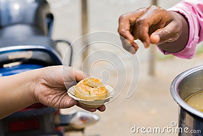 Phuchka or Pani Puri being served on a bowl made of shal leaves in india. This popular street food is also called gupchup or Stock Photo