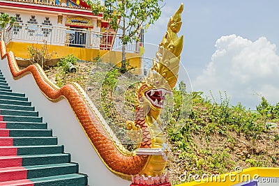 Phuket, Thailand - April 25, 2016 : The main stair leading to the replica of Phra That In-Kwaen Hanging Golden Rock , Thailand Stock Photo
