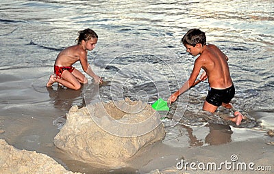 Phuket, Thailand: Children Making Sand Castle Editorial Stock Photo