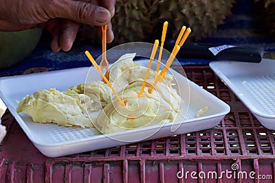 Phuket, Thailand food market: pieces of fresh durian to sample Stock Photo