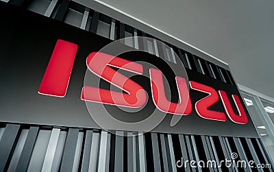 PHUKET, THAILAND - JUNE 05, 2022: Signboard with logo of Isuzu Motors Editorial Stock Photo