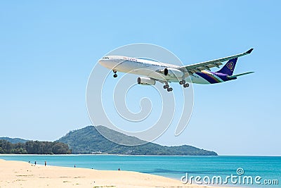PHUKET, THAILAND - MARCH 11: Landing airplane at Phuket Editorial Stock Photo