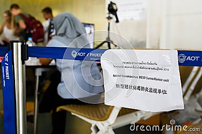 Phuket, Thailand - March 04 2020. Paper with announcement of temperature control zone, monitor of thermal scanner camera Editorial Stock Photo