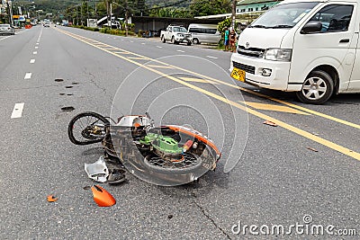 PHUKET, THAILAND - NOVEMBER 3 : Van accident on the road and crashed with motorcycle which causing the rider serious injury. Editorial Stock Photo