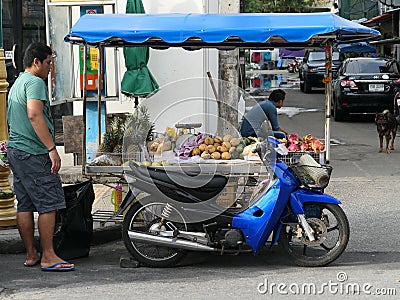 Thailand - Phuket - Blue Scooter Market Editorial Stock Photo