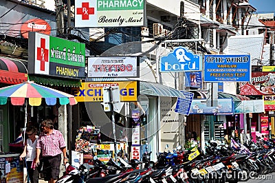 Phuket, Thailand: Shop Signs and Motorbikes Editorial Stock Photo
