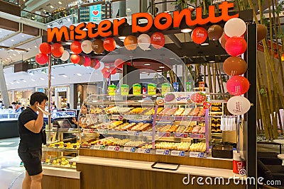 A customer deciding on a donut Editorial Stock Photo