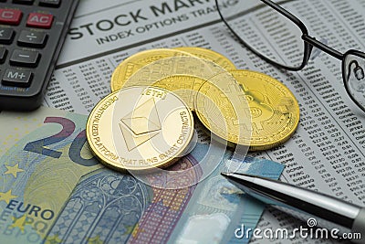 Physical criptocurrency coins on mockup financial page with banknote Editorial Stock Photo