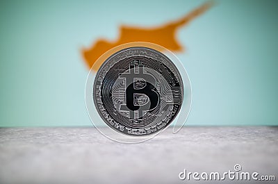 Physical silver version of Bitcoin BTC and Cyprus Flag on the background. Conceptual image for investors in Stock Photo