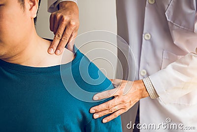 Physical therapists are using their hands to press the clavicle of the patient Stock Photo