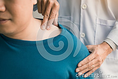 Physical therapists are using their hands to press the clavicle of the patient Stock Photo