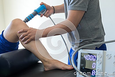 Physical therapy of the knee and the foot with shock wave Stock Photo