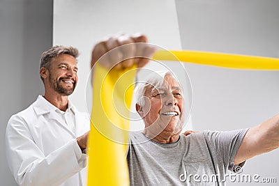 Physical Therapy Patient Using Physiotherapy Bands Stock Photo