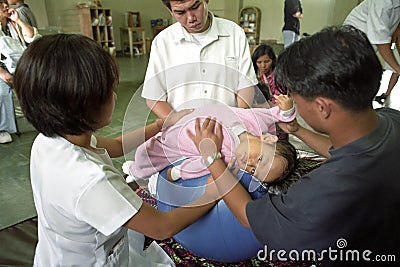 Physical therapy for spastic Filipino girl Editorial Stock Photo