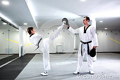 Physically challenged girl in martial arts training taekwondo Stock Photo