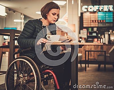 Physically challenged women in a cafe Stock Photo