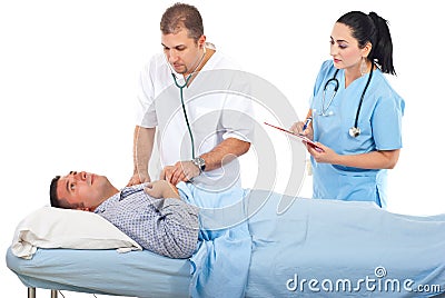 Physician assess sick patient in hospital Stock Photo