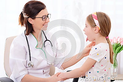 Physician checking girls glands Stock Photo