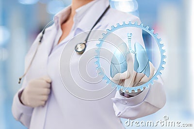 Physician clicks on the icon of a human lung. Stock Photo