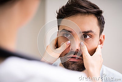 Physician Doctor Doing Sinusitis Examination Stock Photo