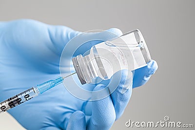 Physician preparing injectable drug or vaccine Stock Photo