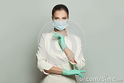 Physician woman in medical mask on white background. Medicine, cosmetology and vaccination concept Stock Photo