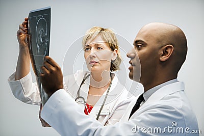 Physicians reading xray. Stock Photo