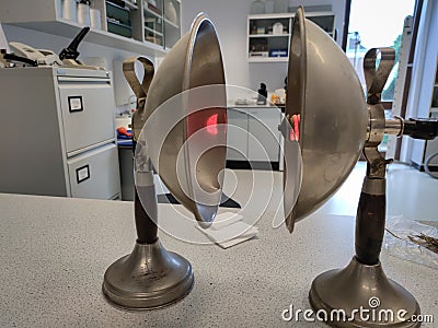 Physics radiation experiment with two opposing parabolic mirrors Stock Photo