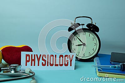 Physiology Planning on Background of Working Table with Office Supplies. Stock Photo