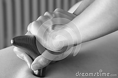 Physiotherapist / chiropractor doing a back massage Stock Photo