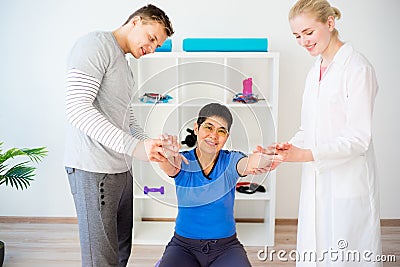 Physiotherapist helping a senior woman Stock Photo