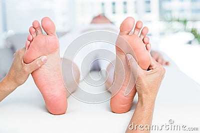 Physiotherapist massaging her patients foot Stock Photo