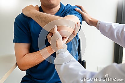 Physiotherapist working concept, Doctor and patient suffering or Chiropractor examining from shoulder pain in clinic medical Stock Photo