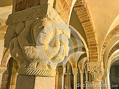 The sculptured column capital in Crypt of San Savino Church, on April 6 in Piacenza, Italy Editorial Stock Photo