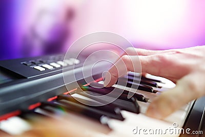 Pianist musician performing live playing keyboard in a band Stock Photo