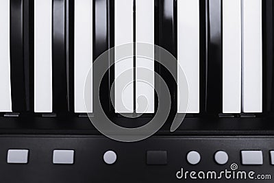 Piano or electronic synthesizer piano keyboard background Midi keyboard and controller with faders and buttons. Concept of close Stock Photo