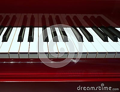 Piano and Piano keyboard with red bourdeaux backgrounds. Stock Photo