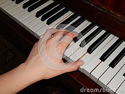 Piano keys hand music Stock Photo