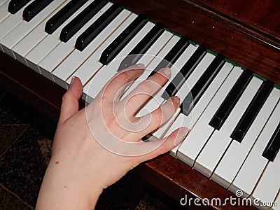 Piano keys hand music Stock Photo