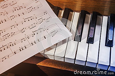 Piano keys and sheet music Stock Photo