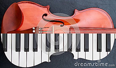 piano keys in to the violin on the black leather table, half keyboard like violin shape Stock Photo