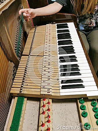 Piano repair strings inside a baby grand piano Stock Photo
