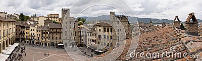 A cloudy day in Arezzo: a view of the city`s bell towers, towers, and roofs from the Confraternita dei Laici tower Editorial Stock Photo