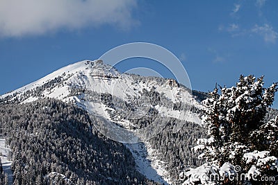 Pic covered in Snow. Mountain in the Dolomites in Val Gardena seen from La Selva in Wolkenstein in GrÃ¶den. Winter Landscape Stock Photo