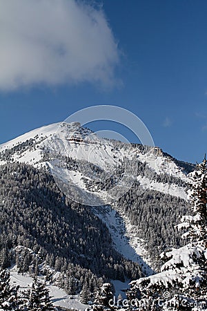 Pic covered in Snow. Mountain in the Dolomites in Val Gardena seen from La Selva in Wolkenstein in GrÃ¶den. Winter Landscape Stock Photo