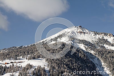 Pic covered in Snow. Mountain in the Dolomites in Val Gardena seen from La Selva in Wolkenstein in GrÃ¶den. Winter Landscape Stock Photo